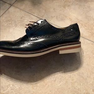 Navy blue size 10.5 wing tip shoes.